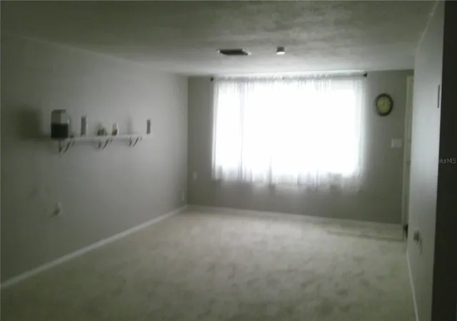 Photo 2 of Single family home for sale at 1203 Chancellor Dr, Holiday, FL 34690 | MLS# TB8528450 | Listing updated on 2026-09-04