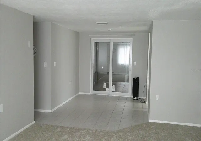 Photo 3 of Single family home for sale at 1203 Chancellor Dr, Holiday, FL 34690 | MLS# TB8528450 | Listing updated on 2026-09-04