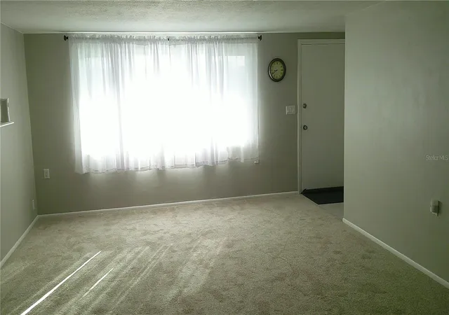 Photo 3 of Single family home for sale at 1203 Chancellor Dr, Holiday, FL 34690 | MLS# TB8528450 | Listing updated on 2026-09-04