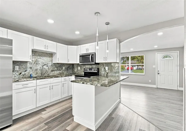 Photo 4 of Single family home for sale at 11011 Pickering Ln, Port Richey, FL 34668 | MLS# TB8528571 | Listing updated on 2026-09-05
