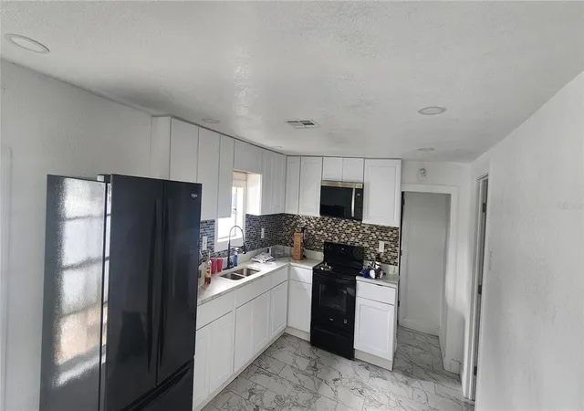 Photo 2 of Single family home for sale at 3004 E Dr Martin Luther King Jr Blvd, Tampa, FL 33610 | MLS# TB8528943 | Listing updated on 2026-08-01