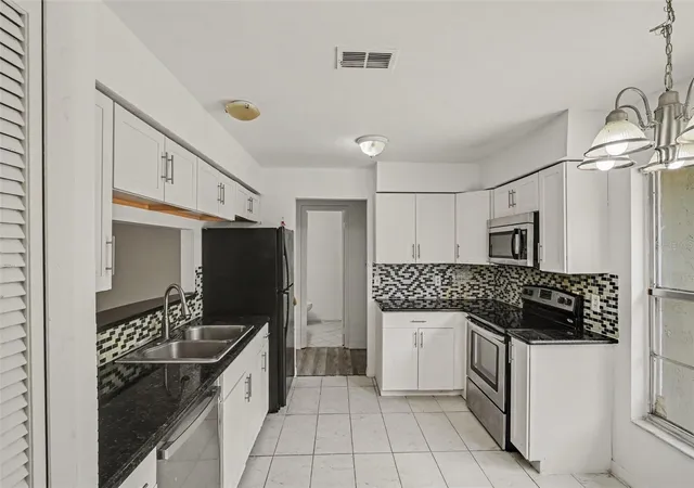 Photo 1 of Single family home for sale at 7774 Barberry Dr, Orlando, FL 32835 | MLS# TB8528974 | Listing updated on 2026-10-04