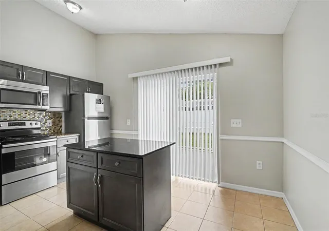 Photo 2 of Single family home for sale at 5655 New Cambridge Rd, Orlando, FL 32810 | MLS# O6424894 | Listing updated on 2026-08-13