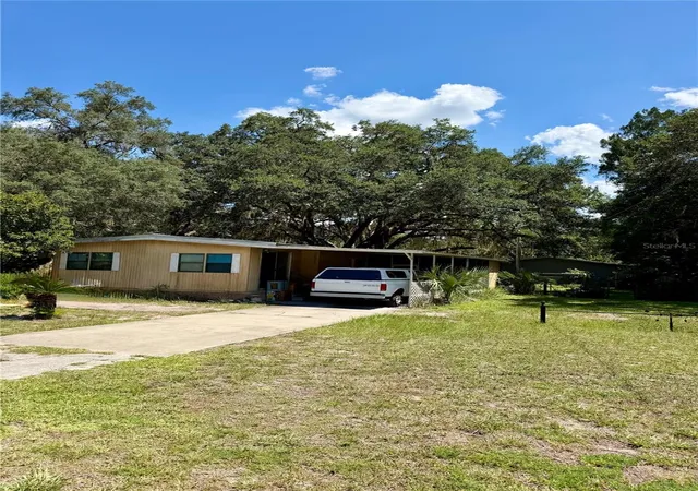 Photo 1 of Manufactured home for sale at 14928 Ne 154th Place, Fort Mc Coy, FL 32134 | MLS# OM728464 | Listing updated on 2026-09-21