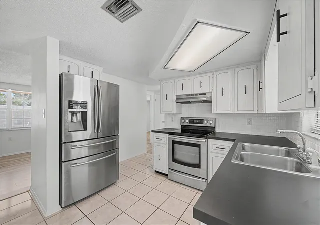 Photo 4 of Single family home for sale at 9830 Rainbow Ln, Port Richey, FL 34668 | MLS# TB8529453 | Listing updated on 2026-10-05