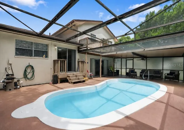 Photo 3 of Single family home for sale at 8609 Village Ml Row, Hudson, FL 34667 | MLS# W7887716 | Listing updated on 2026-09-22
