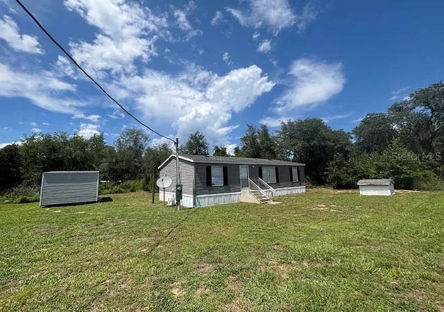 Photo 2 of Manufactured home for sale at 15299 Ne 238th Street, Fort Mc Coy, FL 32134 | MLS# OM728665 | Listing updated on 2026-08-14