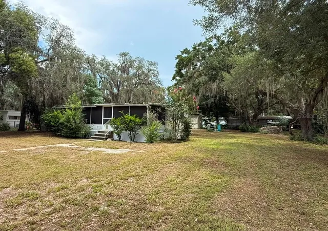 1st image of 27416 Walnut Ave, Okahumpka, FL 34762 | MLS# O6426026