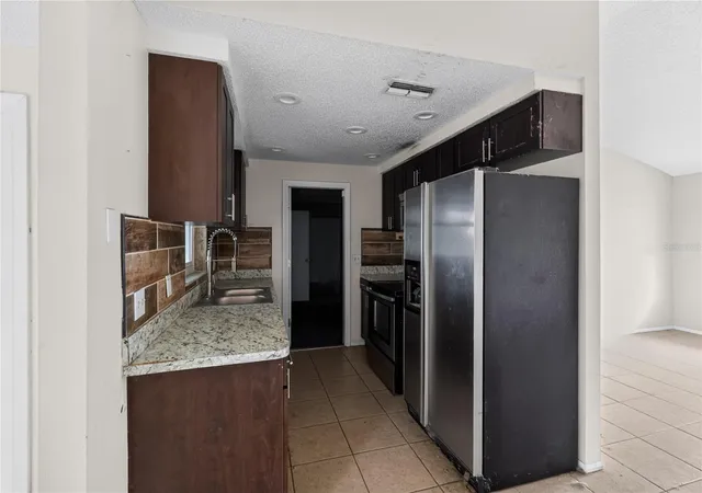 Photo 4 of Single family home for sale at 7036 Ashwood Dr, Port Richey, FL 34668 | MLS# O6426408 | Listing updated on 2026-09-28