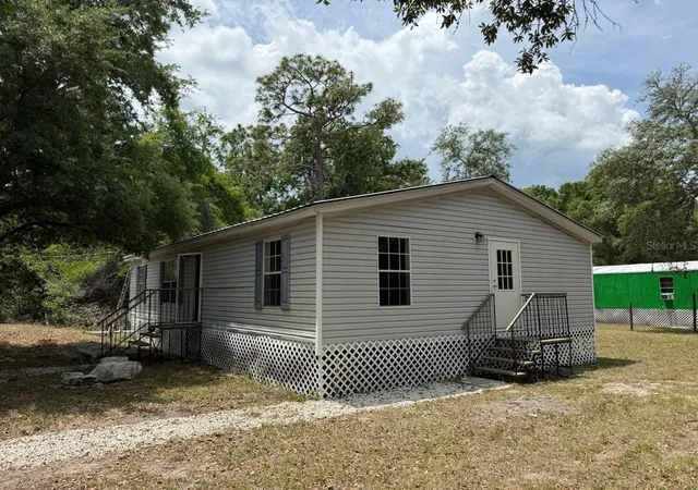 Photo 1 of Manufactured home for sale at 10405 Jungle St, New Port Richey, FL 34654 | MLS# TB8530881 | Listing updated on 2026-08-26