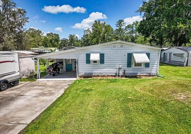 Photo 2 of Manufactured home for sale at 104 Edgewater Rd, Satsuma, FL 32189 | MLS# OM728882 | Listing updated on 2026-08-29