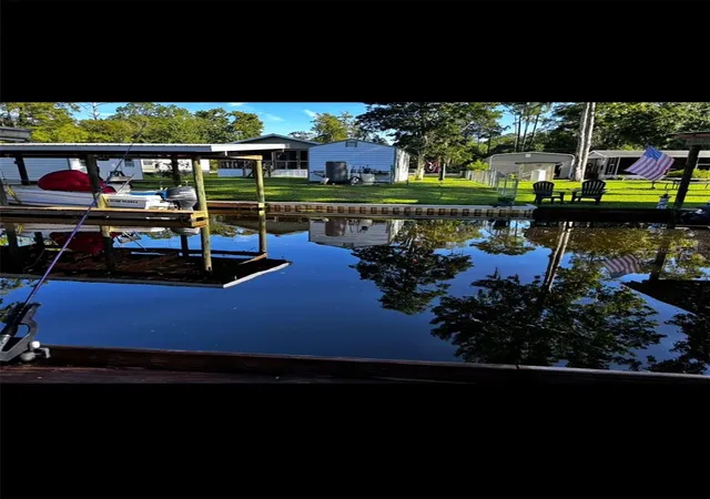 Photo 4 of Manufactured home for sale at 104 Edgewater Rd, Satsuma, FL 32189 | MLS# OM728882 | Listing updated on 2026-08-29