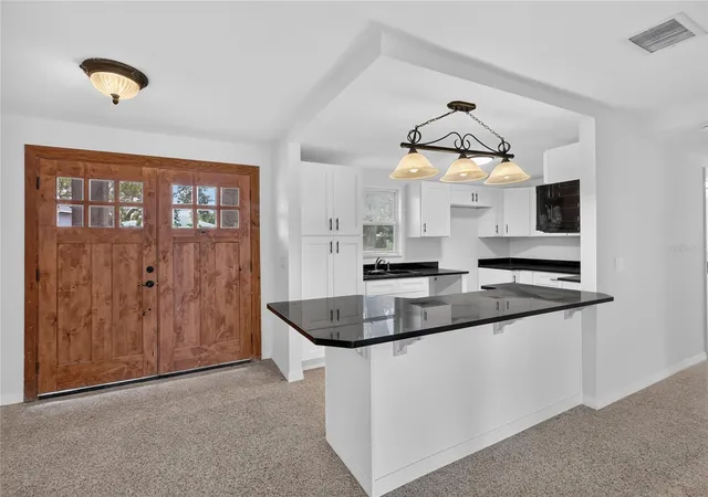 Photo 4 of Single family home for sale at 120 81st Avenue NE, Saint Petersburg, FL 33702 | MLS# TB8531165 | Listing updated on 2026-10-20