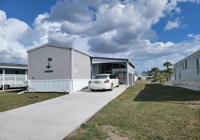 Photo 3 of Manufactured home for sale at 5700 Holiday Park Blvd, North Port, FL 34287 | MLS# A4700762 | Listing updated on 2026-08-28