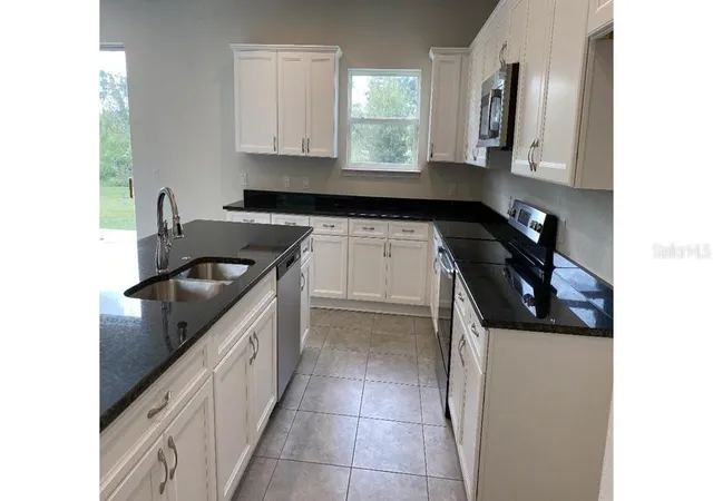 Photo 3 of Single family home for sale at 5637 Abelman Rd, North Port, FL 34291 | MLS# OM729004 | Listing updated on 2026-07-25