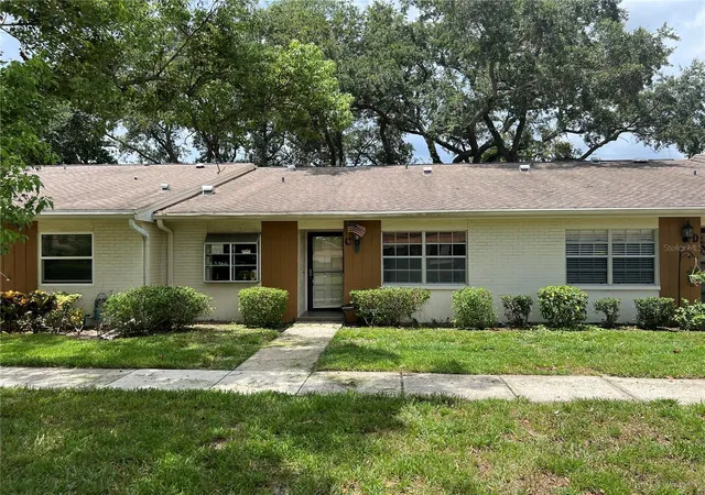 Photo 1 of Condo for sale at 2297 Lark Cir E #C, Palm Harbor, FL 34684 | MLS# TB8531851 | Listing updated on 2026-10-07