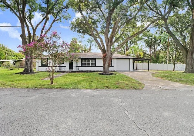 Photo 1 of Single family home for sale at 12113 Midlake Dr, Tampa, FL 33612 | MLS# A4700811 | Listing updated on 2026-09-02