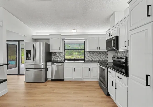 Photo 4 of Single family home for sale at 6444 Crowley Ct, Spring Hill, FL 34609 | MLS# TB8532068 | Listing updated on 2026-10-01