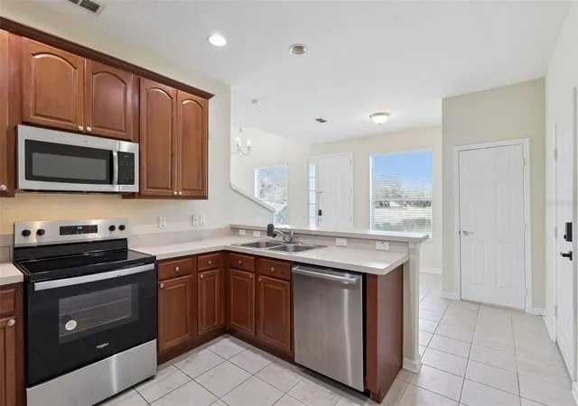 Photo 3 of Townhouse for sale at 1431 Shallcross Ave, Orlando, FL 32828 | MLS# O6427604 | Listing updated on 2026-08-30