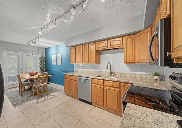 Photo 3 of Townhouse for sale at 13302 Arena Pl, Tampa, FL 33612 | MLS# TB8532450 | Listing updated on 2026-09-05