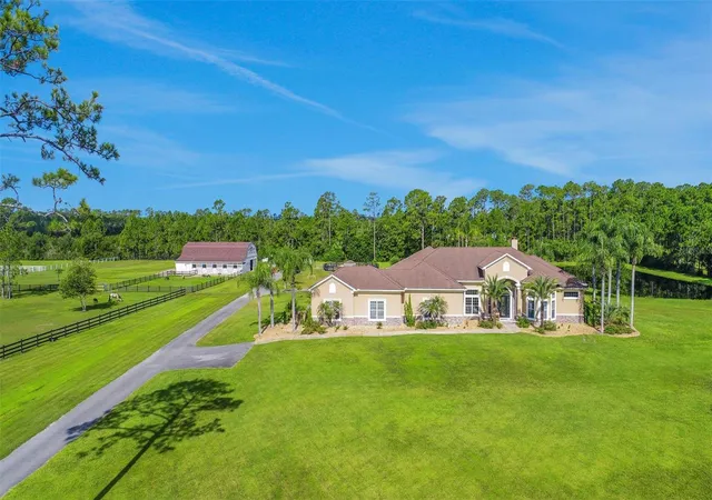 Photo 1 of Single family home for sale at 260 Spring Forest Dr, New Smyrna Beach, FL 32168 | MLS# O6428050 | Listing updated on 2026-08-01