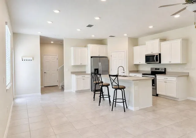 Photo 2 of Townhouse for sale at 5012 Sylvester Loop, Tampa, FL 33610 | MLS# O6428073 | Listing updated on 2026-10-01