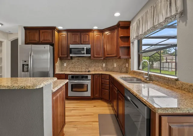 Photo 3 of Single family home for sale at 7437 Pinemount Dr, Orlando, FL 32819 | MLS# O6428324 | Listing updated on 2026-10-24