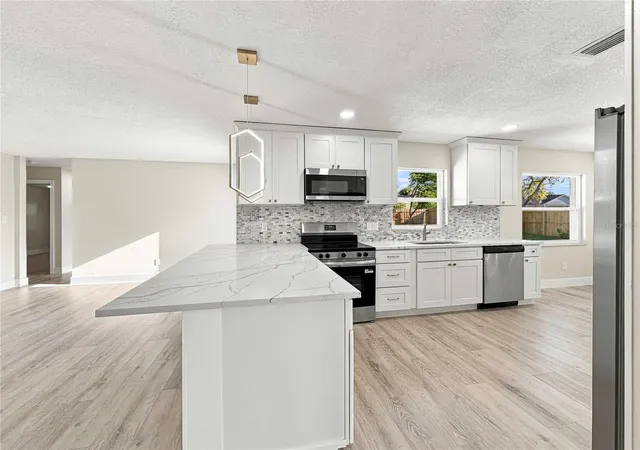 Photo 2 of Single family home for sale at 7015 Crestlake Dr, Orlando, FL 32819 | MLS# O6428433 | Listing updated on 2026-09-22