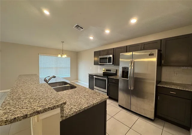 Photo 4 of Single family home for sale at 350 W Aster Ct, Kissimmee, FL 34759 | MLS# P4939440 | Listing updated on 2026-10-21