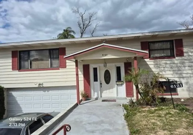 1st image of 6121 Holiday Hill Ln, Orlando, FL 32808 | MLS# O6429291