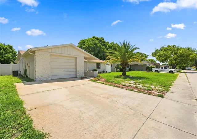 Photo 2 of Single family home for sale at 8936 Windsong Ln, Port Richey, FL 34668 | MLS# W7888098 | Listing updated on 2026-10-01