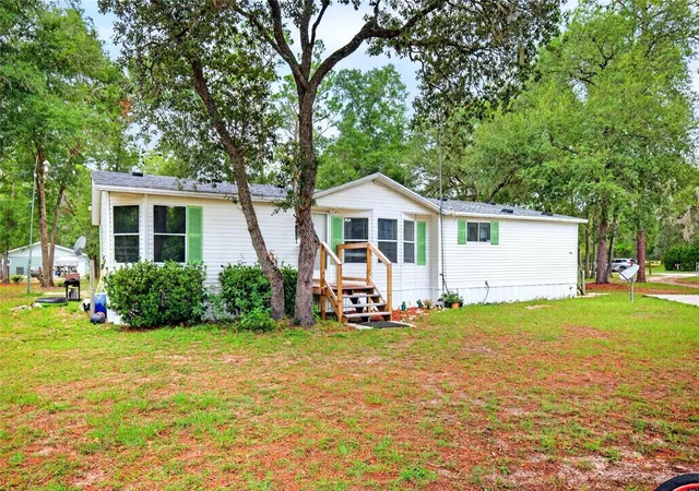1st image of 10890 Ne 102nd Pl, Archer, FL 32618 | MLS# OM729492
