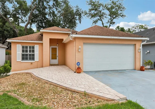 Photo 1 of Single family home for sale at 8711 Busch Oaks St, Tampa, FL 33617 | MLS# TB8534237 | Listing updated on 2026-10-07