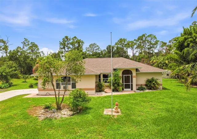 Photo 2 of Single family home for sale at 2209 Tropicaire Blvd, North Port, FL 34286 | MLS# TB8534448 | Listing updated on 2026-10-08