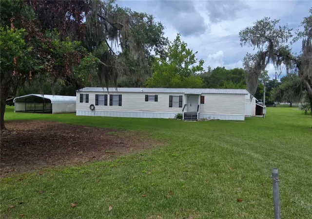 Photo 1 of Manufactured home for sale at 105 Canary Ln, Satsuma, FL 32189 | MLS# S5154876 | Listing updated on 2026-08-31