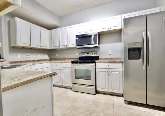Photo 2 of Condo for sale at 5578 Metrowest Blvd #1-201, Orlando, FL 32811 | MLS# O6430733 | Listing updated on 2026-09-06