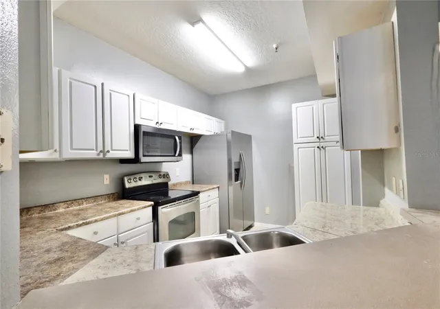 Photo 3 of Condo for sale at 5578 Metrowest Blvd #1-201, Orlando, FL 32811 | MLS# O6430733 | Listing updated on 2026-09-06