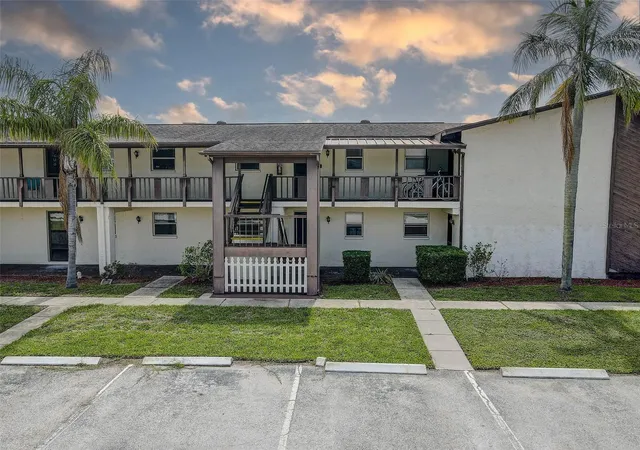 Listing Photo 1 - Condo for sale in building located at 8440 Old Post Rd, PORT RICHEY, FL 34668 - Unit #104
