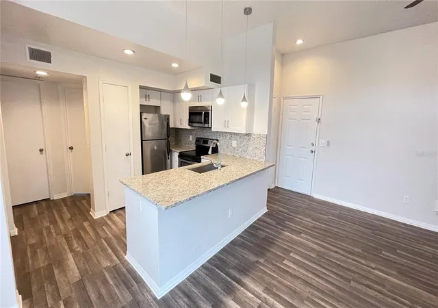 Photo 3 of Condo for sale at 7270 Westpointe Blvd #933, Orlando, FL 32835 | MLS# O6431046 | Listing updated on 2026-10-02