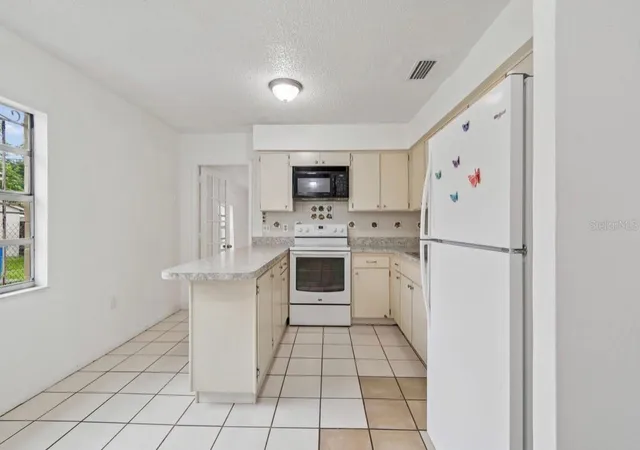 Photo 2 of Single family home for sale at 7516 N Cortez St, Tampa, FL 33614 | MLS# TB8536383 | Listing updated on 2026-09-25