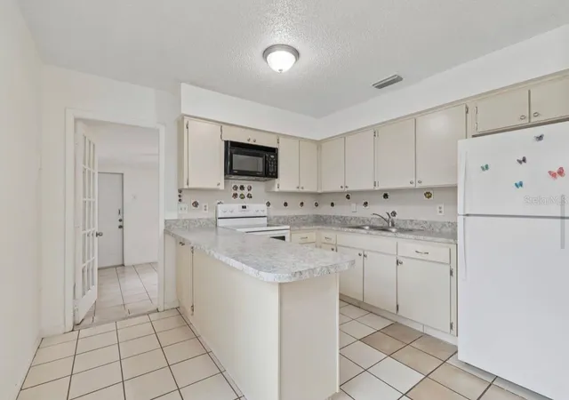 Photo 3 of Single family home for sale at 7516 N Cortez St, Tampa, FL 33614 | MLS# TB8536383 | Listing updated on 2026-09-25