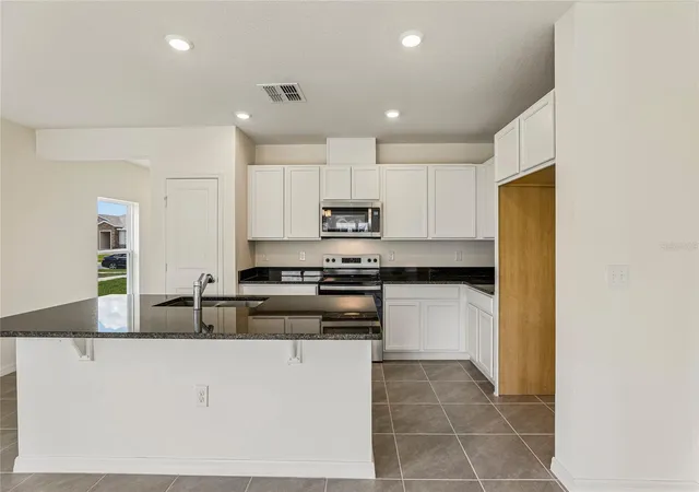 3rd image of 679 Meadows Edge Pl, Lake Wales, FL 33859 | MLS# O6431598