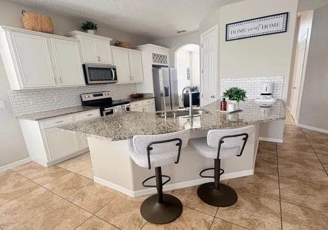 Photo 3 of Single family home for sale at 2248 Stone Lake Ct, Orlando, FL 32824 | MLS# O6431612 | Listing updated on 2026-08-24