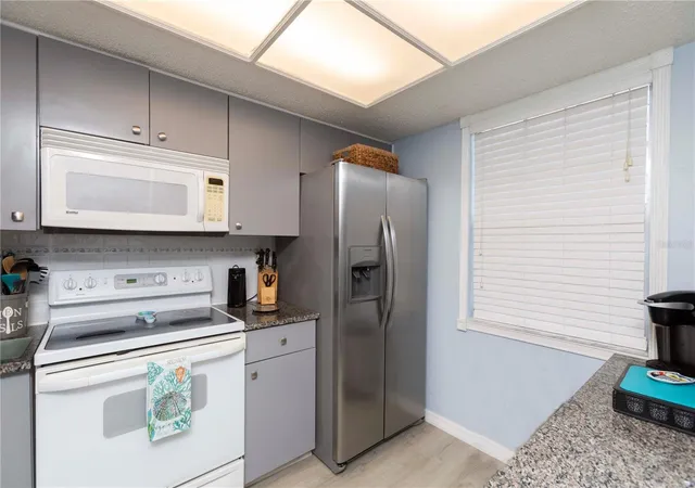 Listing Photo 3 - Condo for sale in building located at 11140 Carriage Hl Dr, Port Richey, FL 34668 - Unit #4