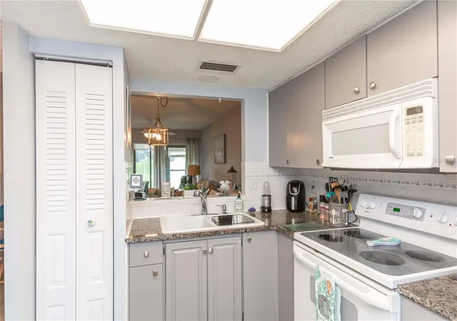 Listing Photo 4 - Condo for sale in building located at 11140 Carriage Hl Dr, Port Richey, FL 34668 - Unit #4