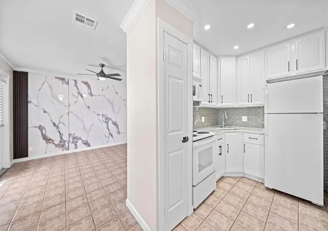 Photo 3 of Single family home for sale at 170 Poinsettia Cir NE, Port Charlotte, FL 33952 | MLS# TB8536928 | Listing updated on 2026-08-11