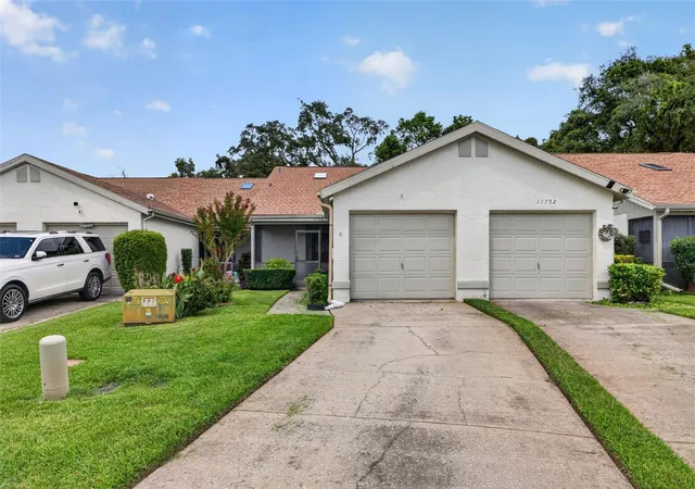 Photo 2 of Single family home for sale at 11754 Spring Tree Ln, Port Richey, FL 34668 | MLS# TB8537243 | Listing updated on 2026-08-10