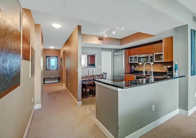 Listing Photo 1 - Condo for sale in building located at 3000 Oasis Grand Blvd, Fort Myers, FL 33916 - Unit #1002