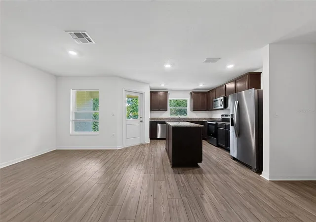 Photo 3 of Townhouse for sale at 1552 Wynford Cir, Tavares, FL 32778 | MLS# O6432244 | Listing updated on 2026-10-07