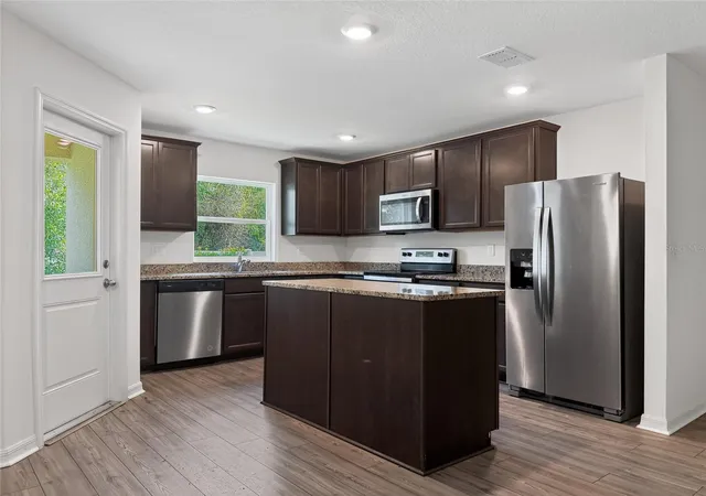 Photo 4 of Townhouse for sale at 1552 Wynford Cir, Tavares, FL 32778 | MLS# O6432244 | Listing updated on 2026-10-07